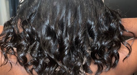 Luxurious dark curls styled at Blowout Boulevard, New York, New York, US.