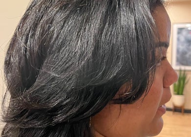Stylish haircut at Blowout Boulevard, New York, New York, US, showcasing glossy, layered black hair.