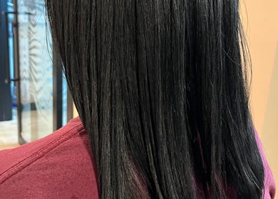Straight black hair styled at Blowout Boulevard in New York, New York, US.