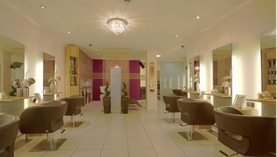 Chic salon interior at Adele@thetherapysuite, Inverness, Scotland, GB with stylish chairs and ambient lighting.