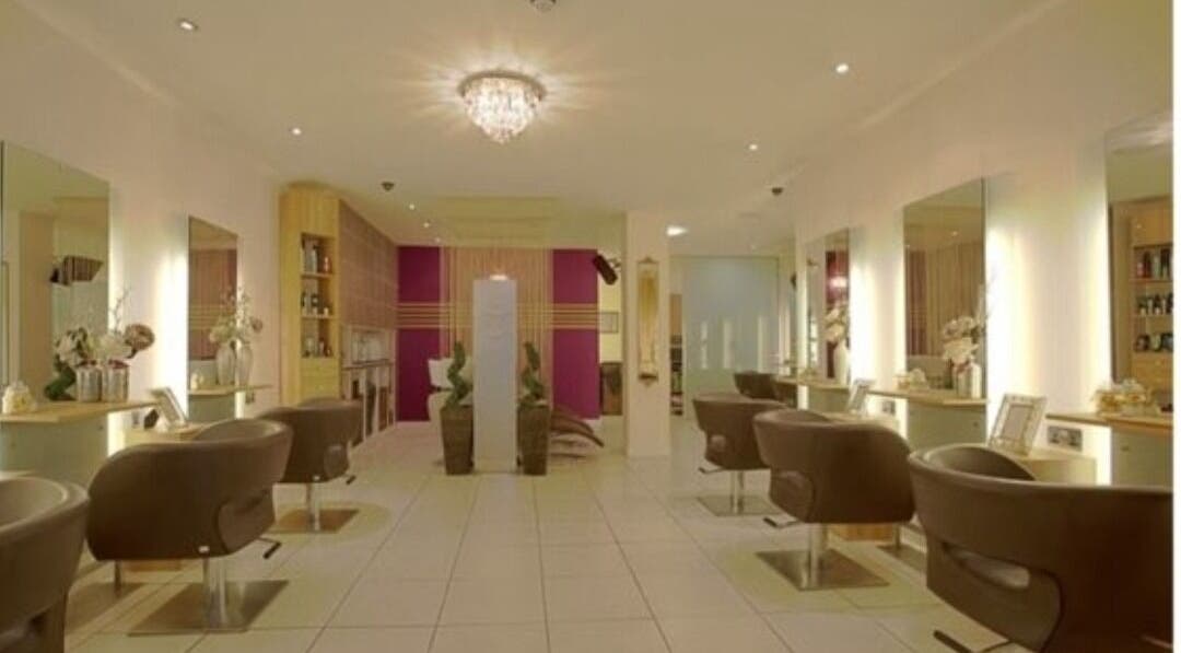 Chic salon interior at Adele@thetherapysuite, Inverness, Scotland, GB with stylish chairs and ambient lighting.