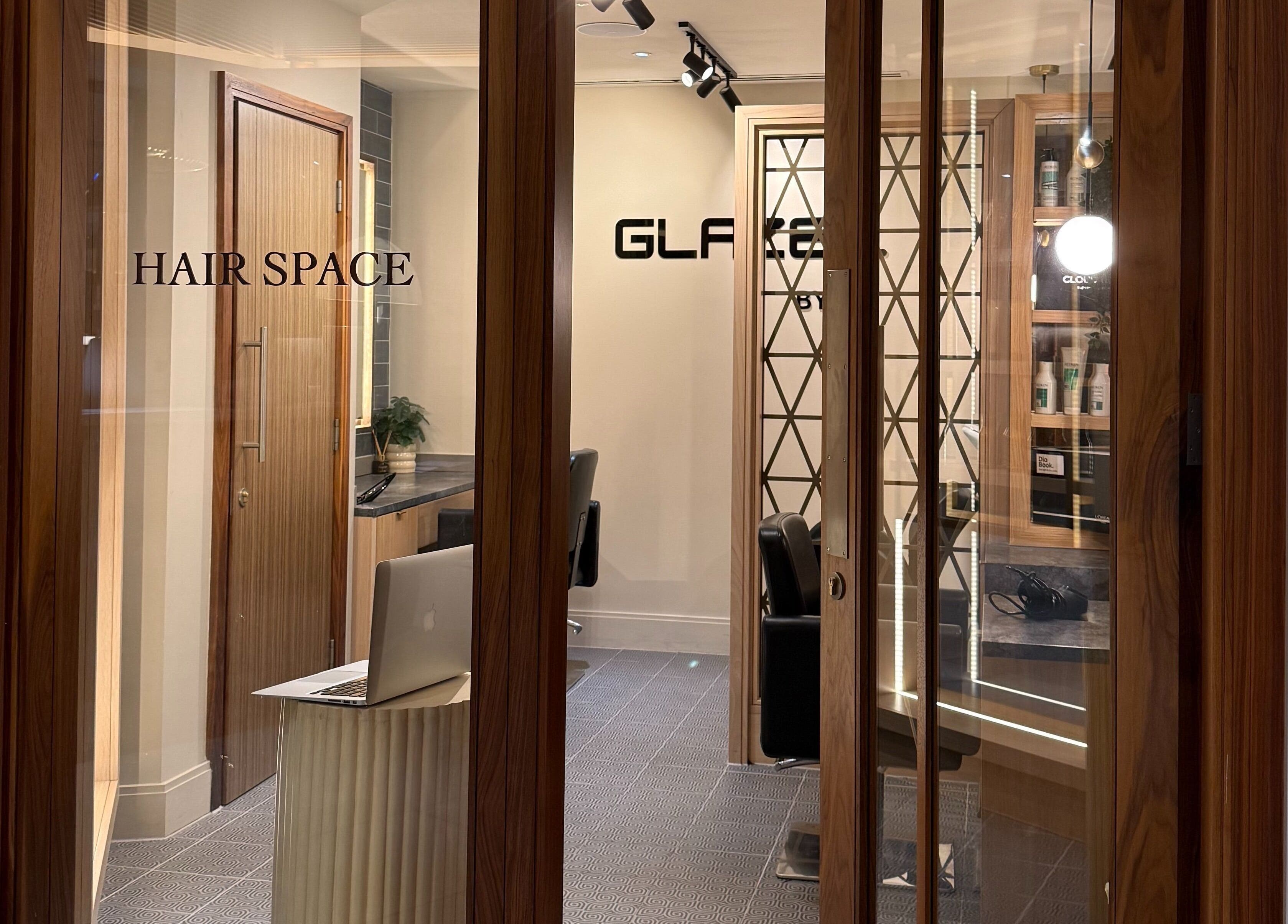Modern salon space at GLAZED By JC in Mottram, England, GB featuring stylish decor and chic furnishings.