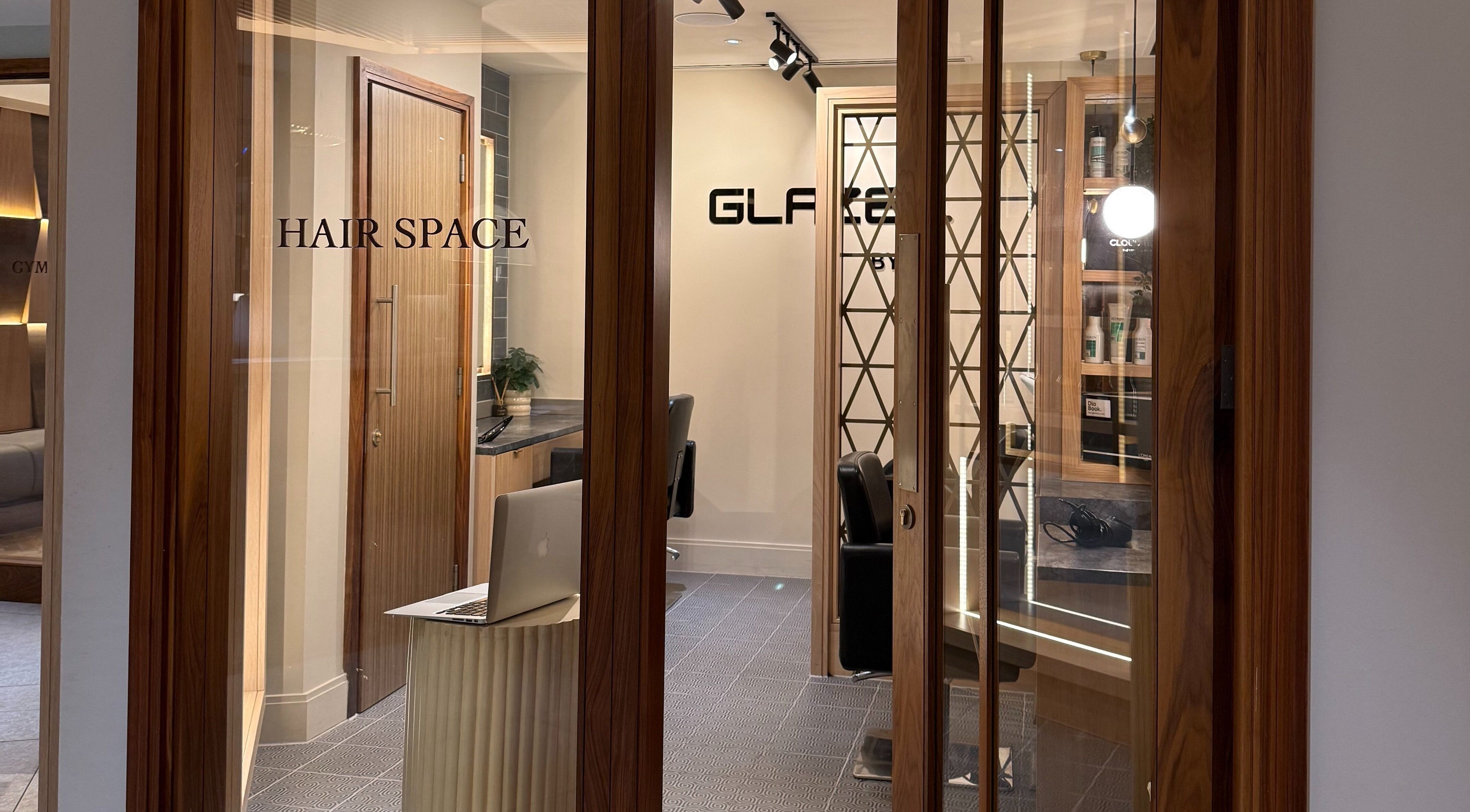 Modern salon space at GLAZED By JC in Mottram, England, GB featuring stylish decor and chic furnishings.
