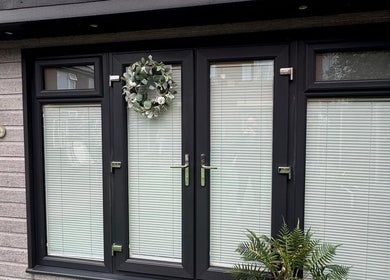 Modern entrance of The Hideaway By Carly, Manchester, England, GB with decorative wreath and plants.