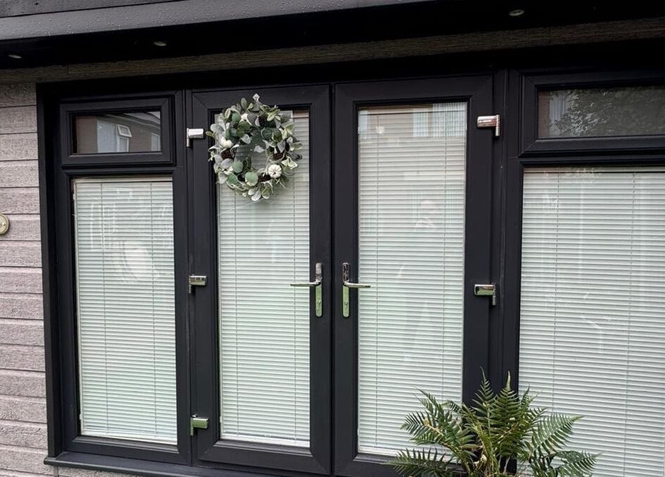 Modern entrance of The Hideaway By Carly, Manchester, England, GB with decorative wreath and plants.