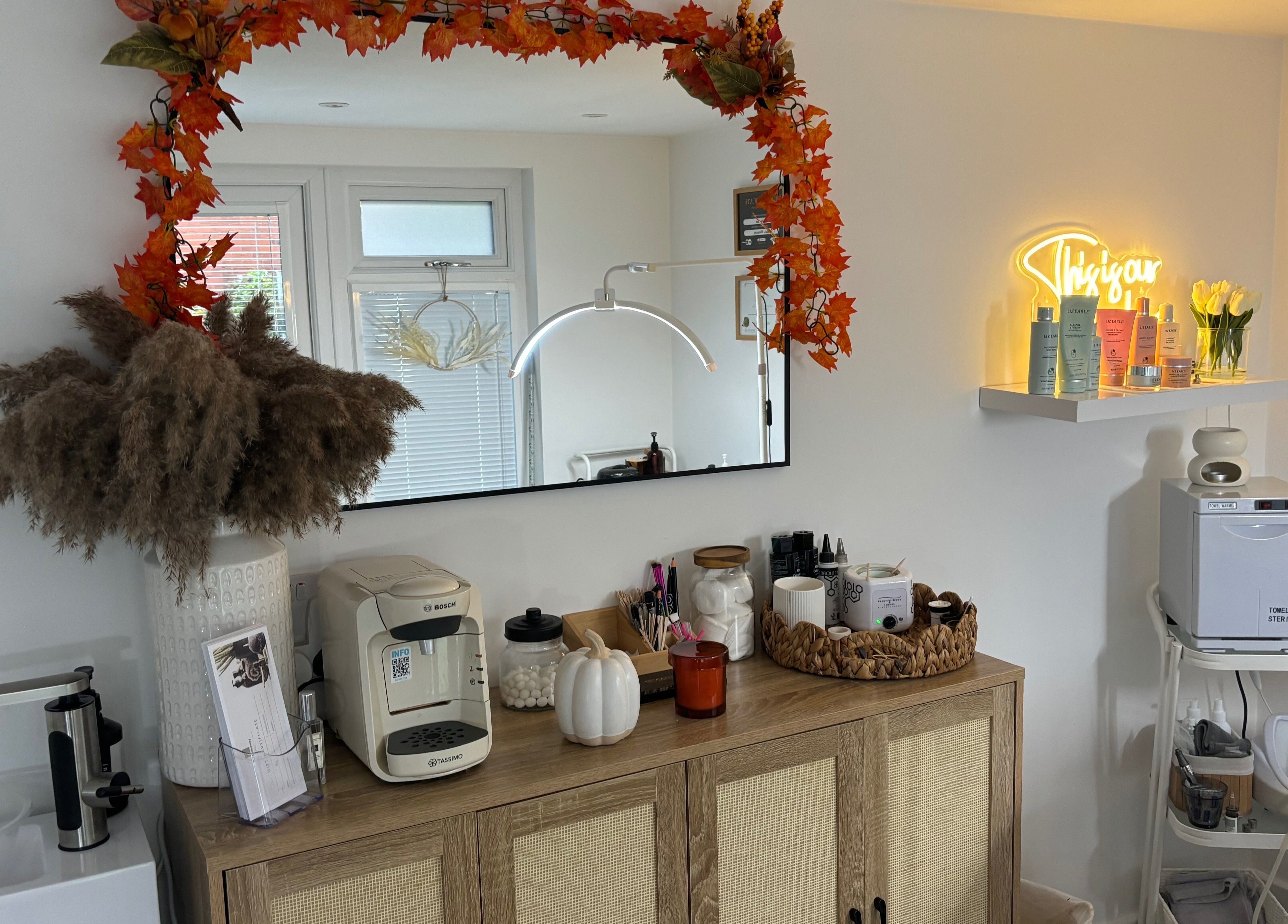 The Hideaway By Carly in Manchester, England, featuring a cozy, autumn-themed decor with wellness products.