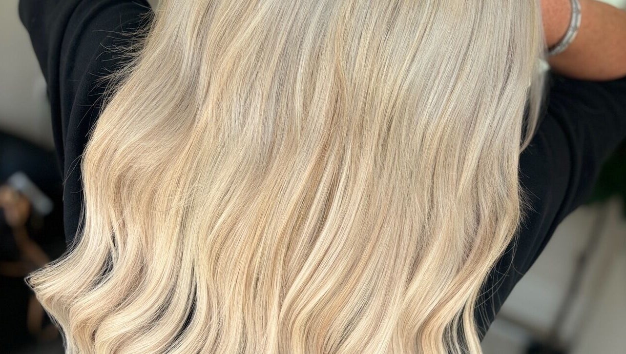 Flowing blonde hair styled at HairbyKeiraMae in Southampton, England, GB showcasing expert coloring.