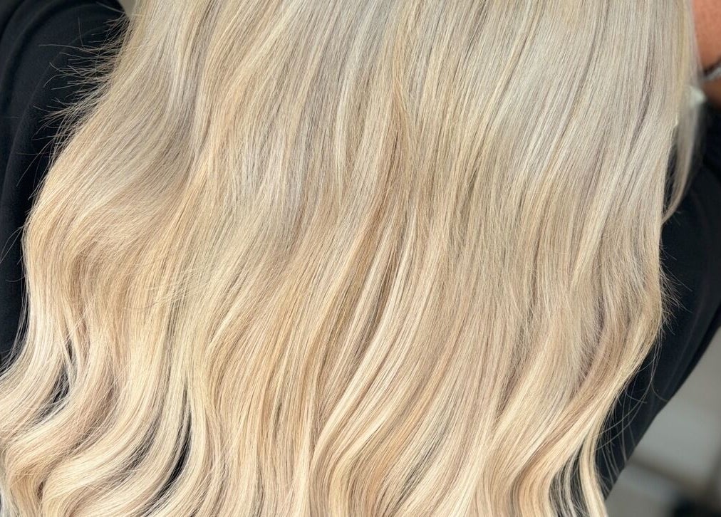 Flowing blonde hair styled at HairbyKeiraMae in Southampton, England, GB showcasing expert coloring.