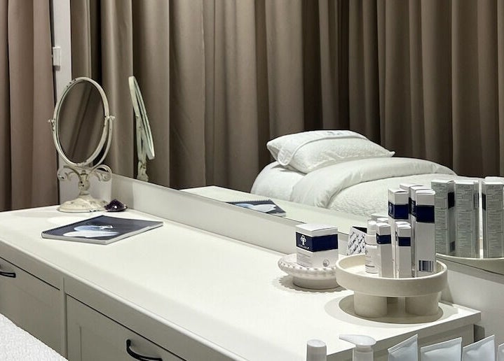 Elegant treatment room at JK Skin Studio, Double Bay, New South Wales, AU with skincare products on display.