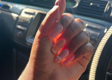 Stylish nails with rhinestones from Bratz Klaws LC, Vieux Fort, Vieux Fort, LC, showcasing elegant nail art.