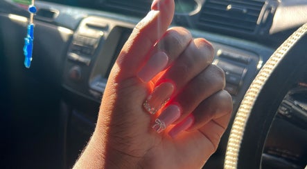 Stylish nails with rhinestones from Bratz Klaws LC, Vieux Fort, Vieux Fort, LC, showcasing elegant nail art.