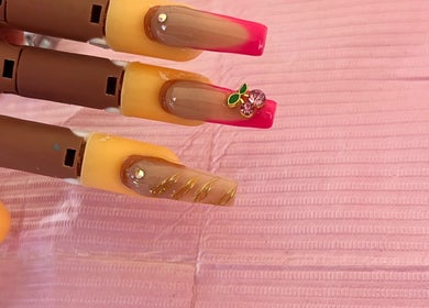 Elegant nail art at Bratz Klaws LC, Vieux Fort, Vieux Fort, LC featuring pink and gold designs.