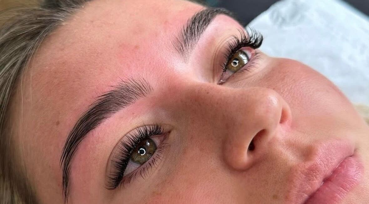 Close-up of beautifully shaped eyebrows and eyelashes at Belles Beauty, Chichester, England, GB.
