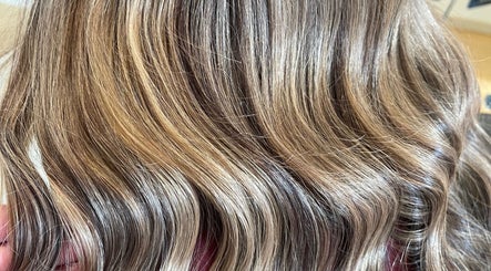 Elegant blonde waves styled at HOUSE OF BLONDE in Drouin, Victoria, AU, showcasing color and texture.