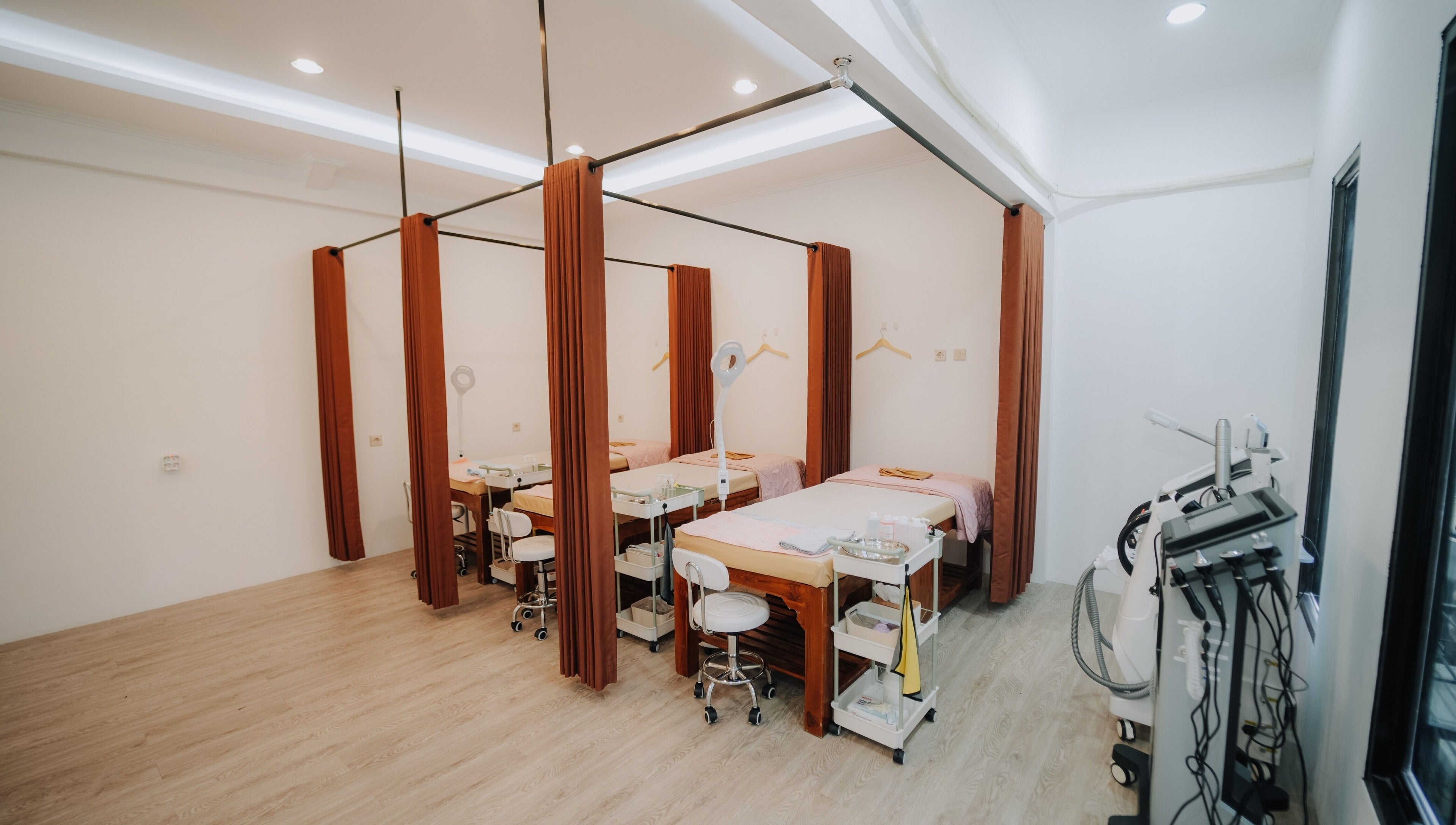 Cozy treatment rooms at Glow In Beauty Studio in Bali, Bali, ID, featuring spa beds and equipment for relaxation.