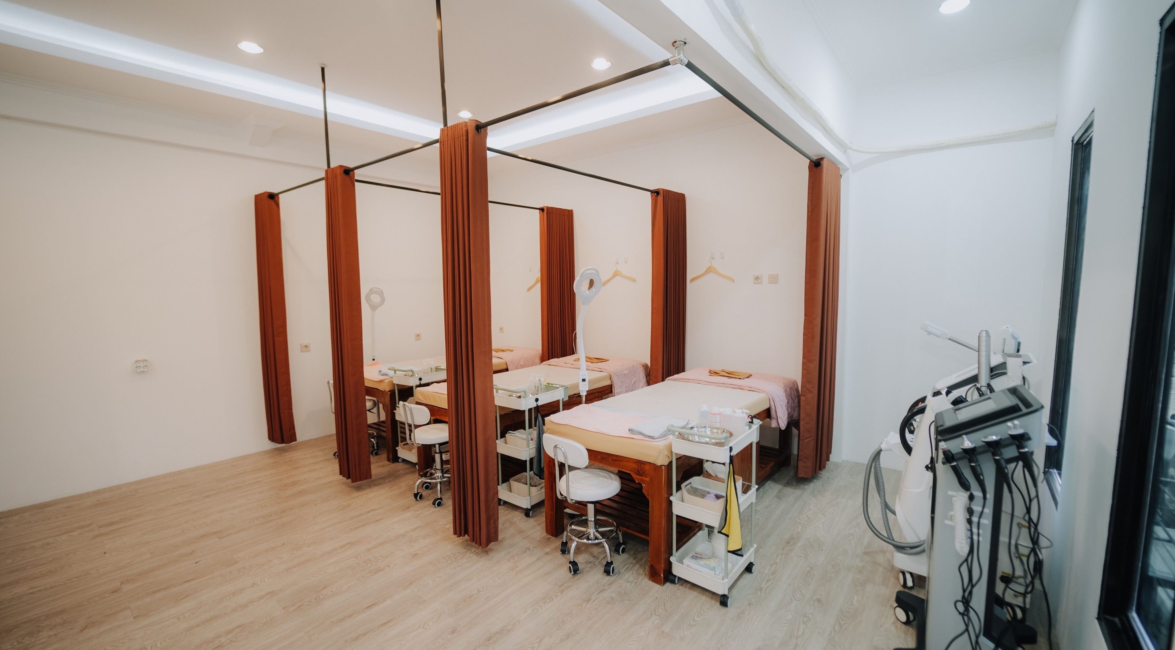 Cozy treatment rooms at Glow In Beauty Studio in Bali, Bali, ID, featuring spa beds and equipment for relaxation.