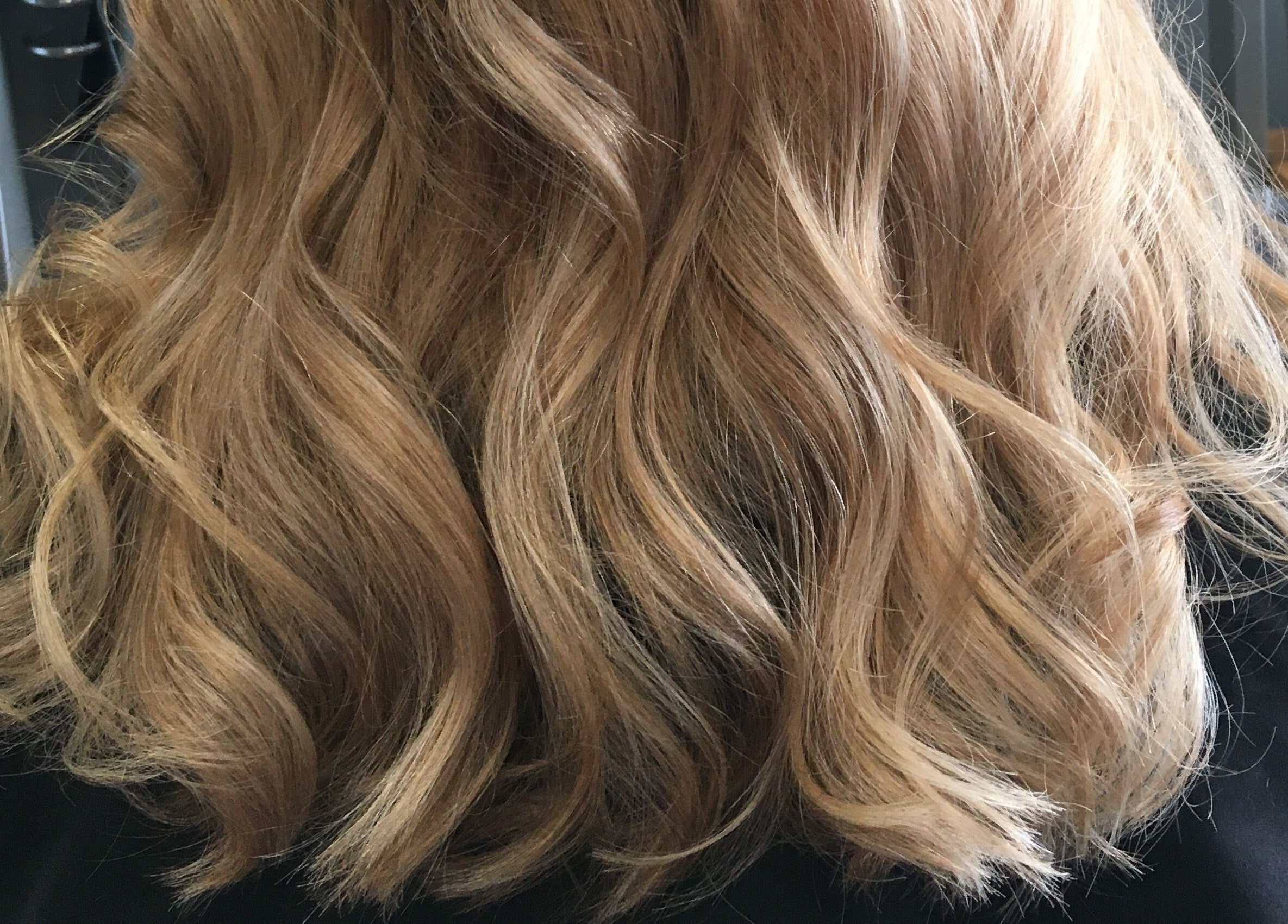 Lustrous wavy blonde hairstyle by Sara @ The Loft by Westworks Collective, Bexhill, England, GB.