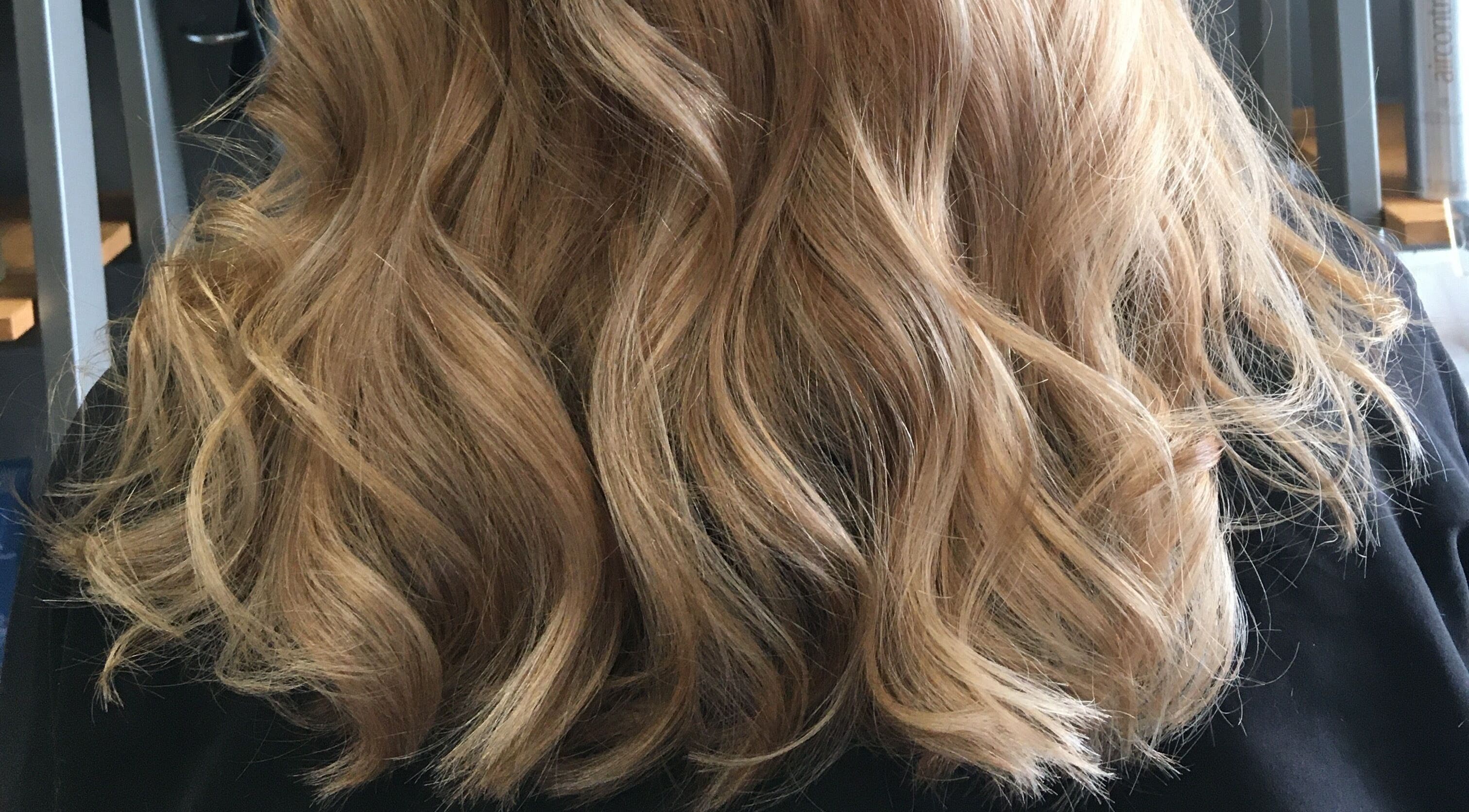 Lustrous wavy blonde hairstyle by Sara @ The Loft by Westworks Collective, Bexhill, England, GB.