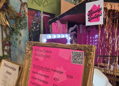 The Massage Boutique's vibrant pink treatment menu in Bristol, England, GB showcasing spa cabin ambiance.