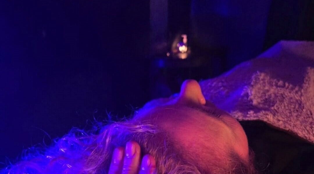 Serene massage at The Massage Boutique, Bristol, England, GB with calming purple lighting.