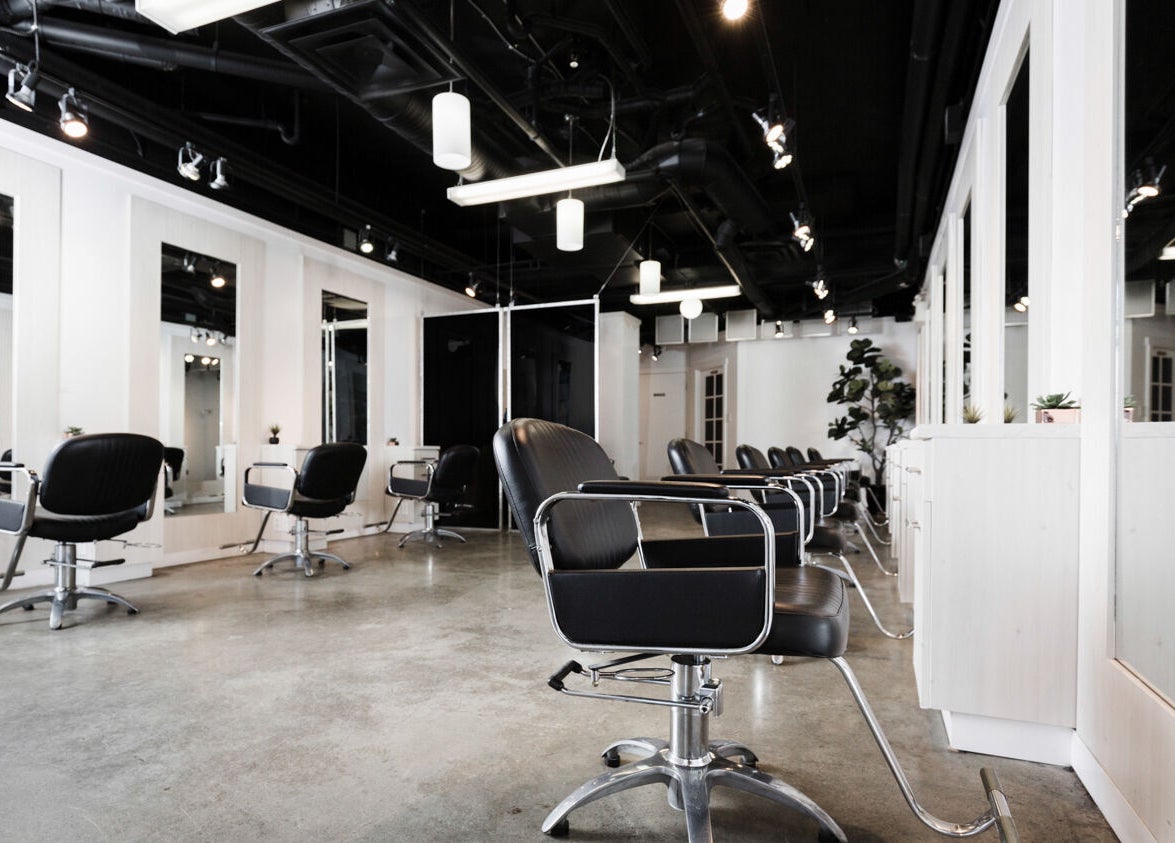 Interior of Sejong Hair Salon Kerrisdale in Vancouver, British Columbia, CA with modern styling chairs and mirrors.