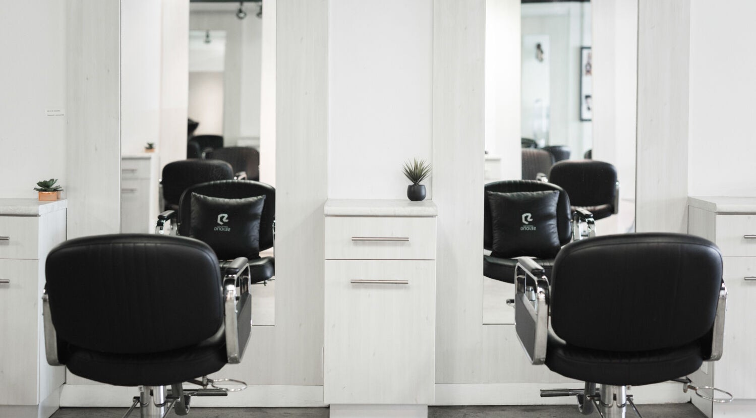 Modern salon chairs and mirrors at Sejong Hair Salon Kerrisdale, Vancouver, British Columbia, CA.
