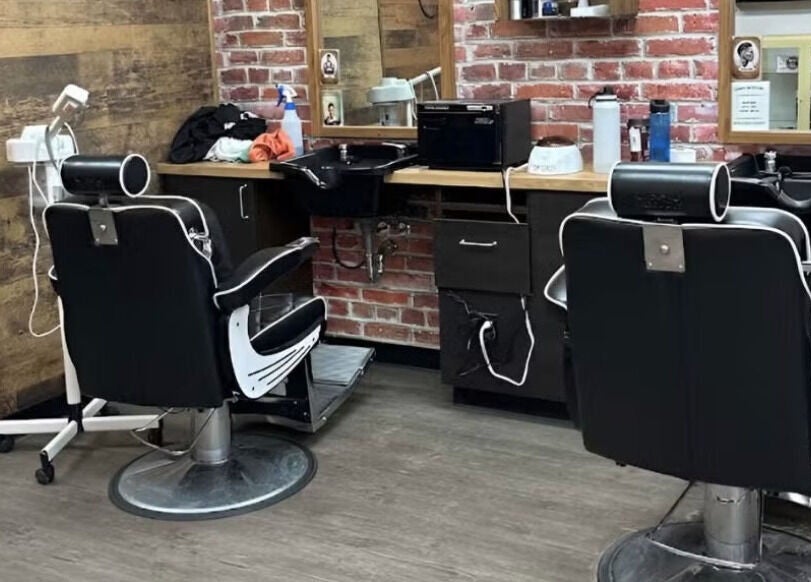 Cozy barber chairs at Mr. Barber Leduc, Leduc, Alberta, CA offering premium hair services.