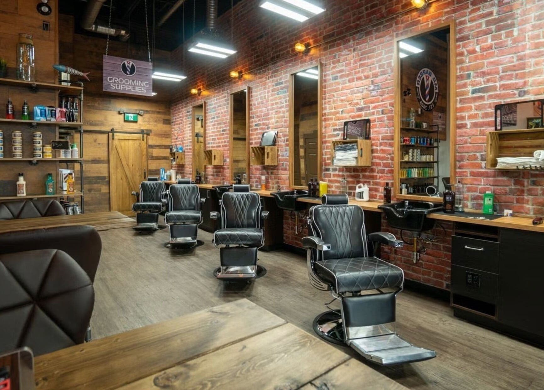 Modern interior of Mr. Barber St. Albert in Alberta, CA showcasing sleek chairs and vintage decor.