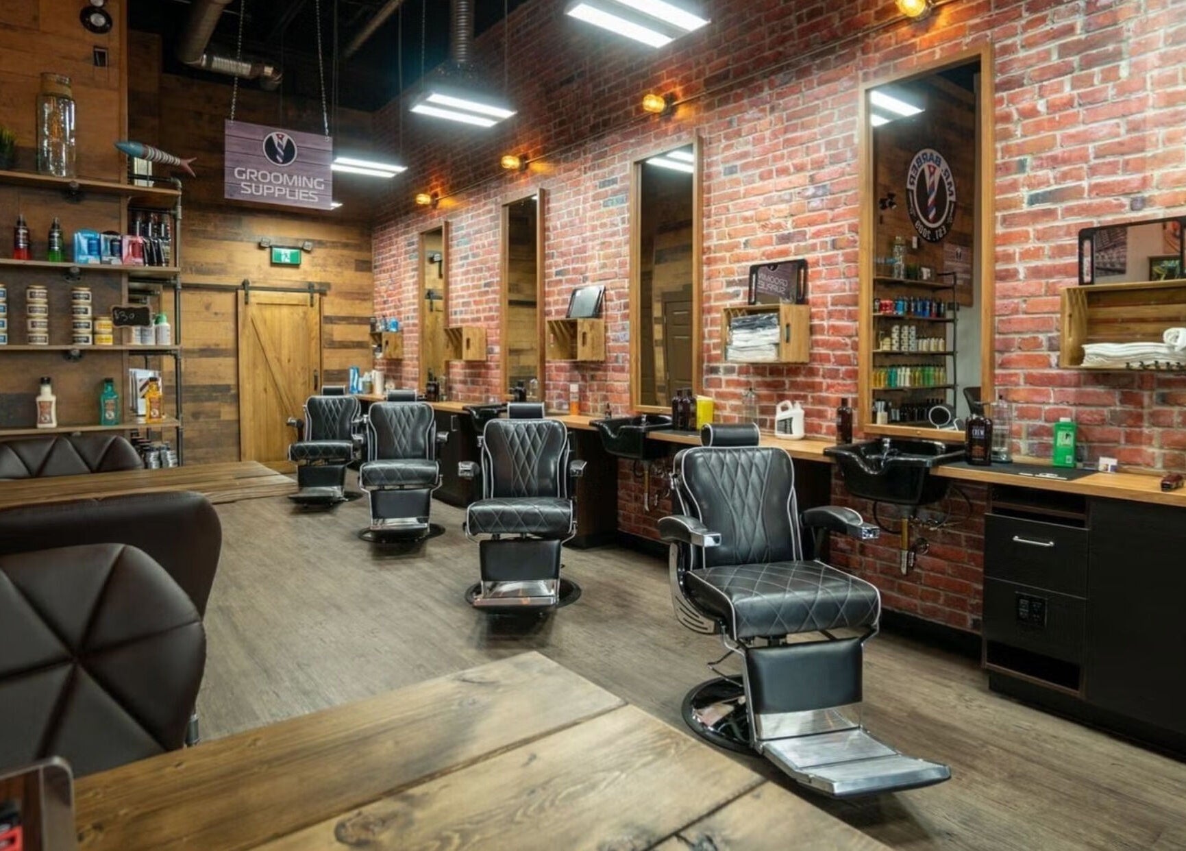Modern interior of Mr. Barber St. Albert in Alberta, CA showcasing sleek chairs and vintage decor.