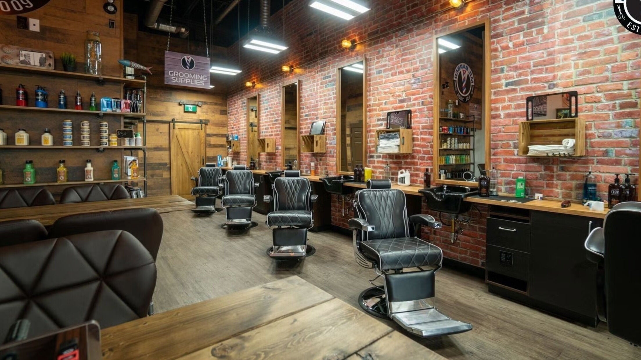 Modern interior of Mr. Barber St. Albert in Alberta, CA showcasing sleek chairs and vintage decor.