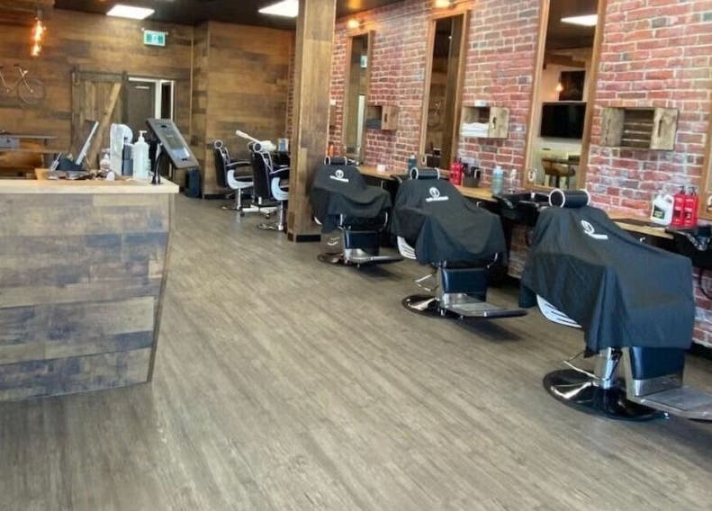 Interior of Mr. Barber St. Albert with rows of barber chairs in St. Albert, Alberta, CA.