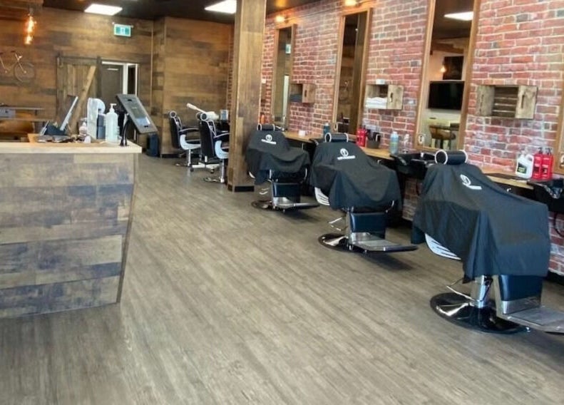 Interior of Mr. Barber St. Albert with rows of barber chairs in St. Albert, Alberta, CA.