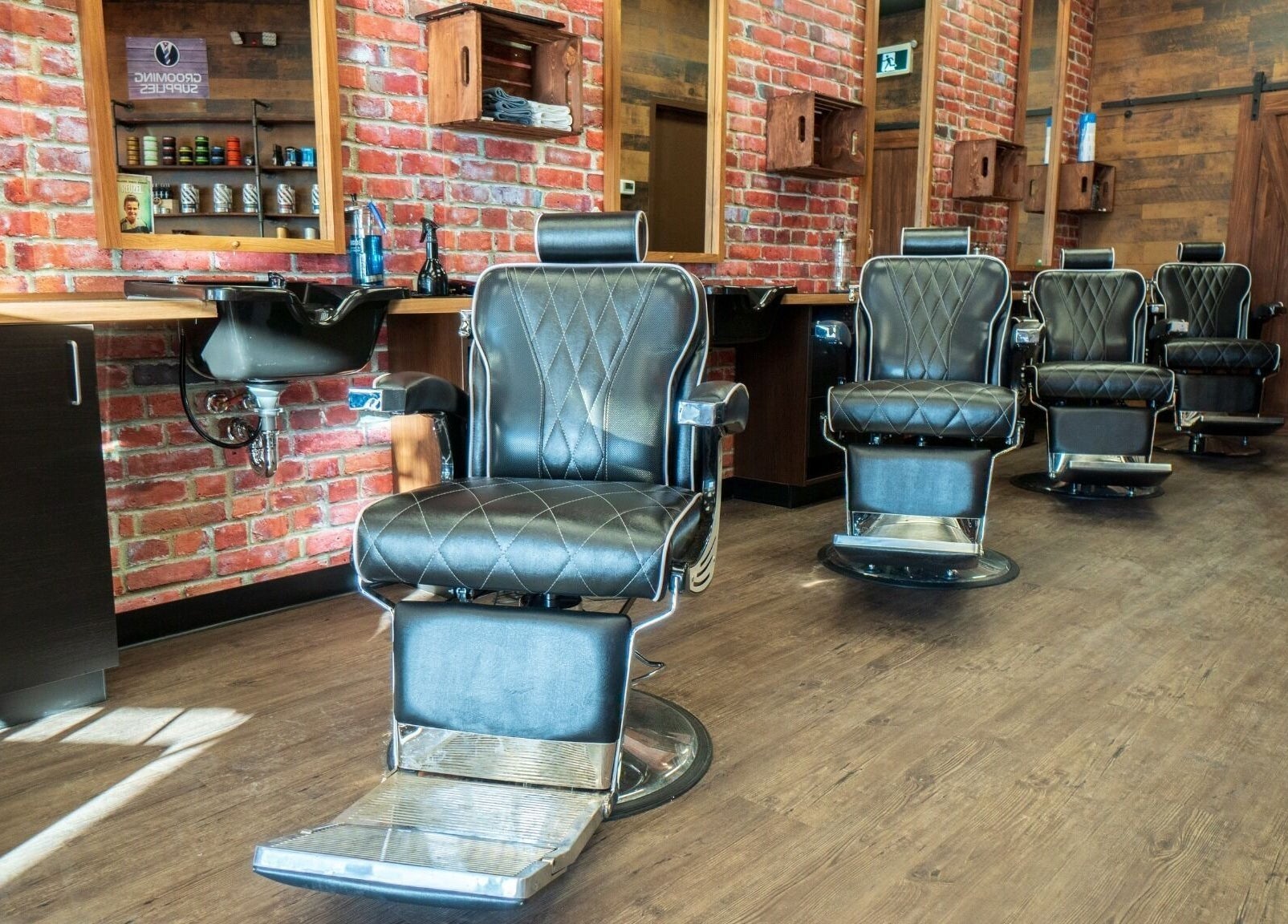 Elegant barber chairs at Mr. Barber Tamarack, Edmonton, Alberta, CA offering premium grooming services.