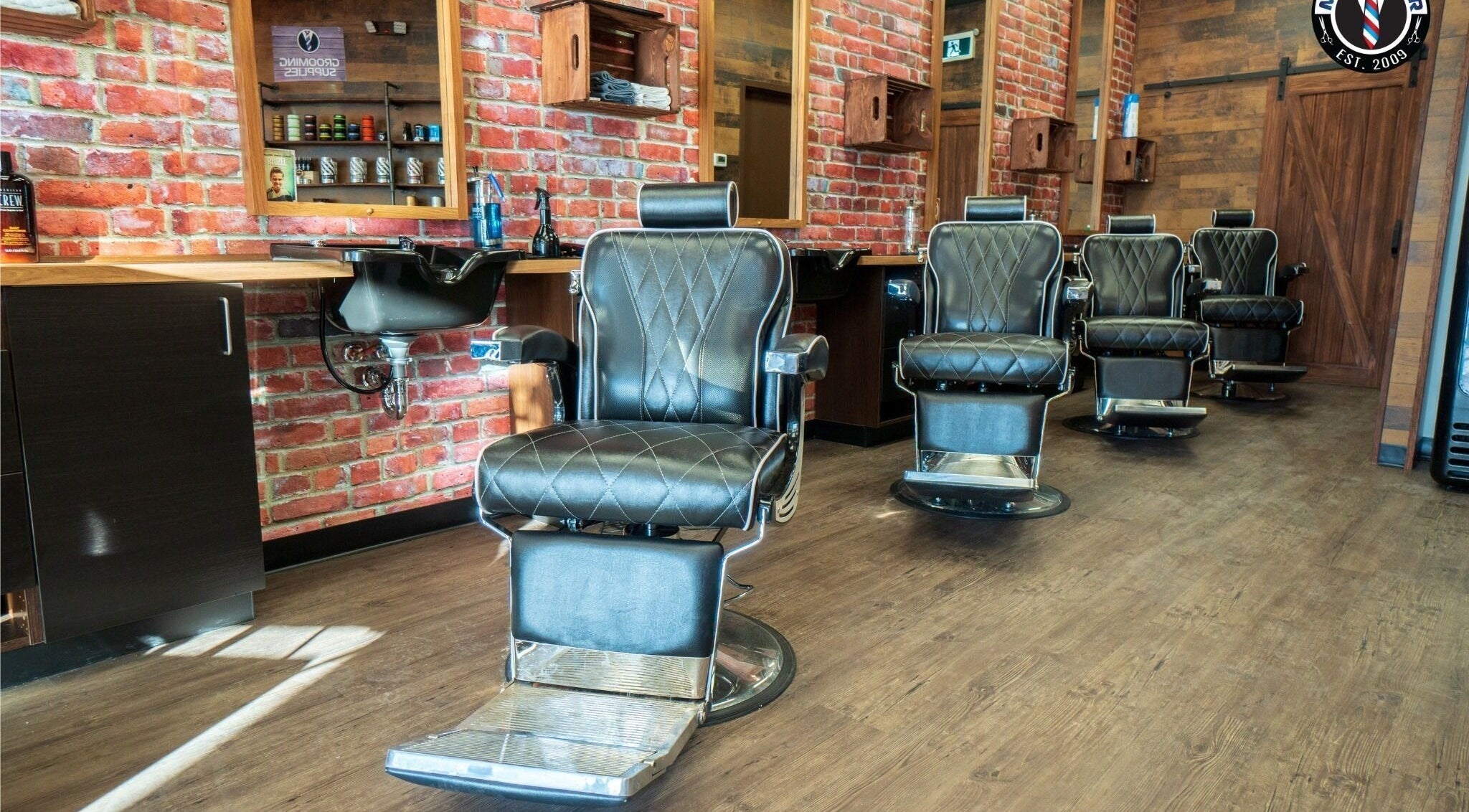Elegant barber chairs at Mr. Barber Tamarack, Edmonton, Alberta, CA offering premium grooming services.