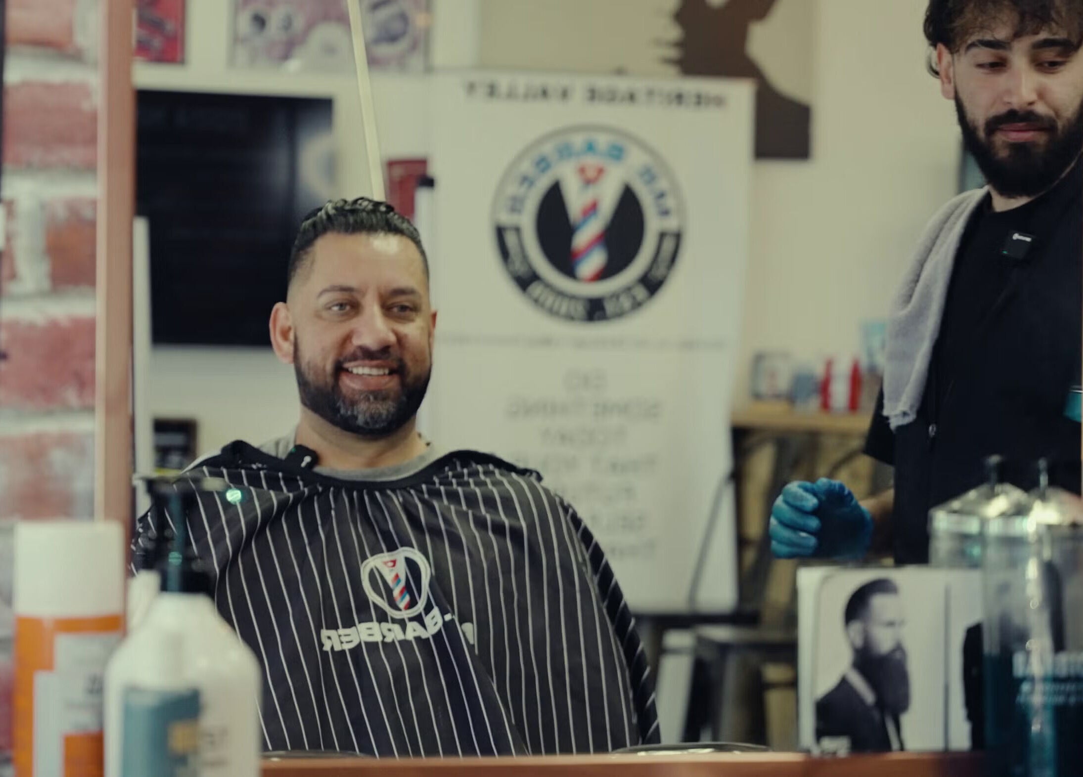 Client enjoys a haircut at Mr. Barber Tamarack in Edmonton, Alberta, CA.