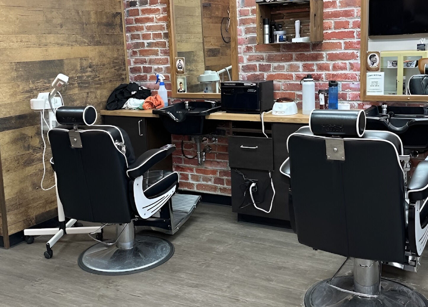 Modern barber chairs and rustic decor at Mr. Barber Unity Square, Edmonton, Alberta, CA.