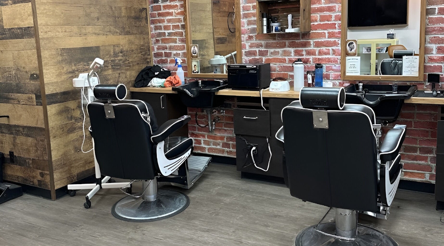 Modern barber chairs and rustic decor at Mr. Barber Unity Square, Edmonton, Alberta, CA.