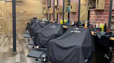 Barber chairs lined up at Mr. Barber Fort Saskatchewan. Cozy, modern interior in Fort Saskatchewan, Alberta, CA.