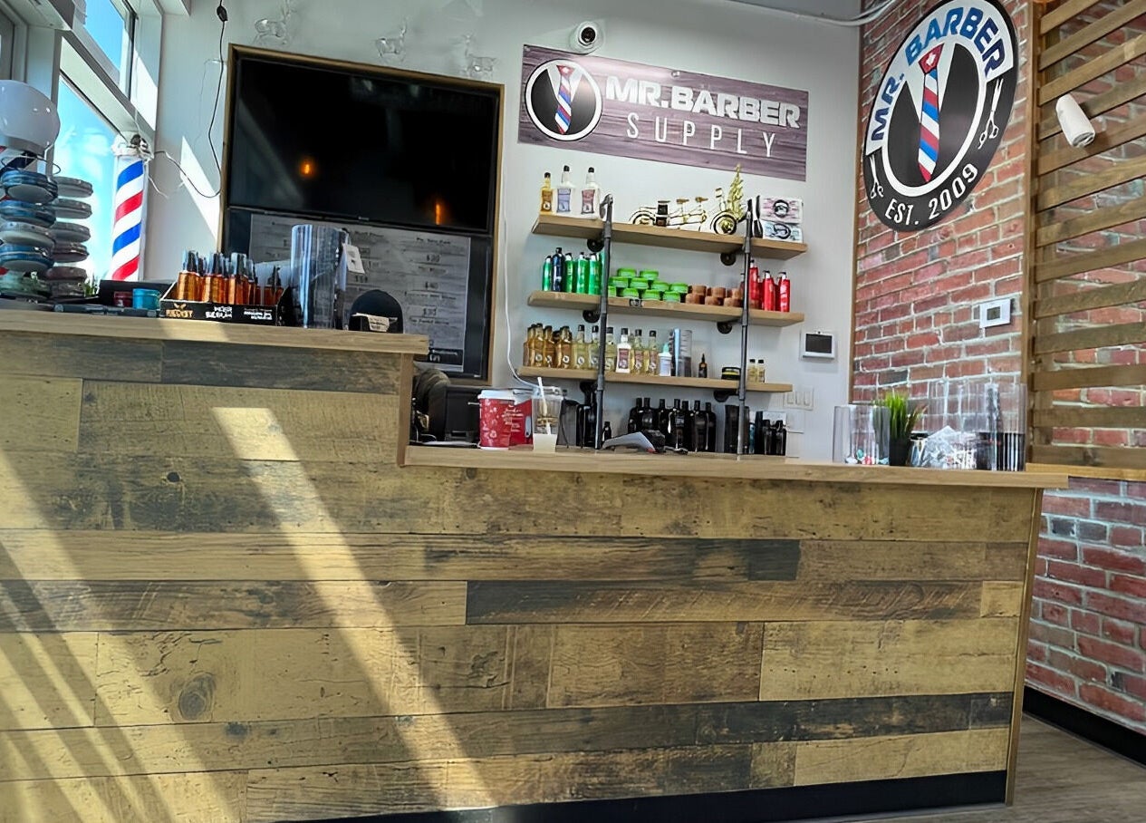 Mr. Barber Fort Saskatchewan reception in Fort Saskatchewan, Alberta, CA with rustic counter and product display.