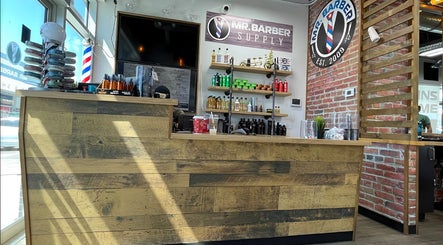 Mr. Barber Fort Saskatchewan reception in Fort Saskatchewan, Alberta, CA with rustic counter and product display.