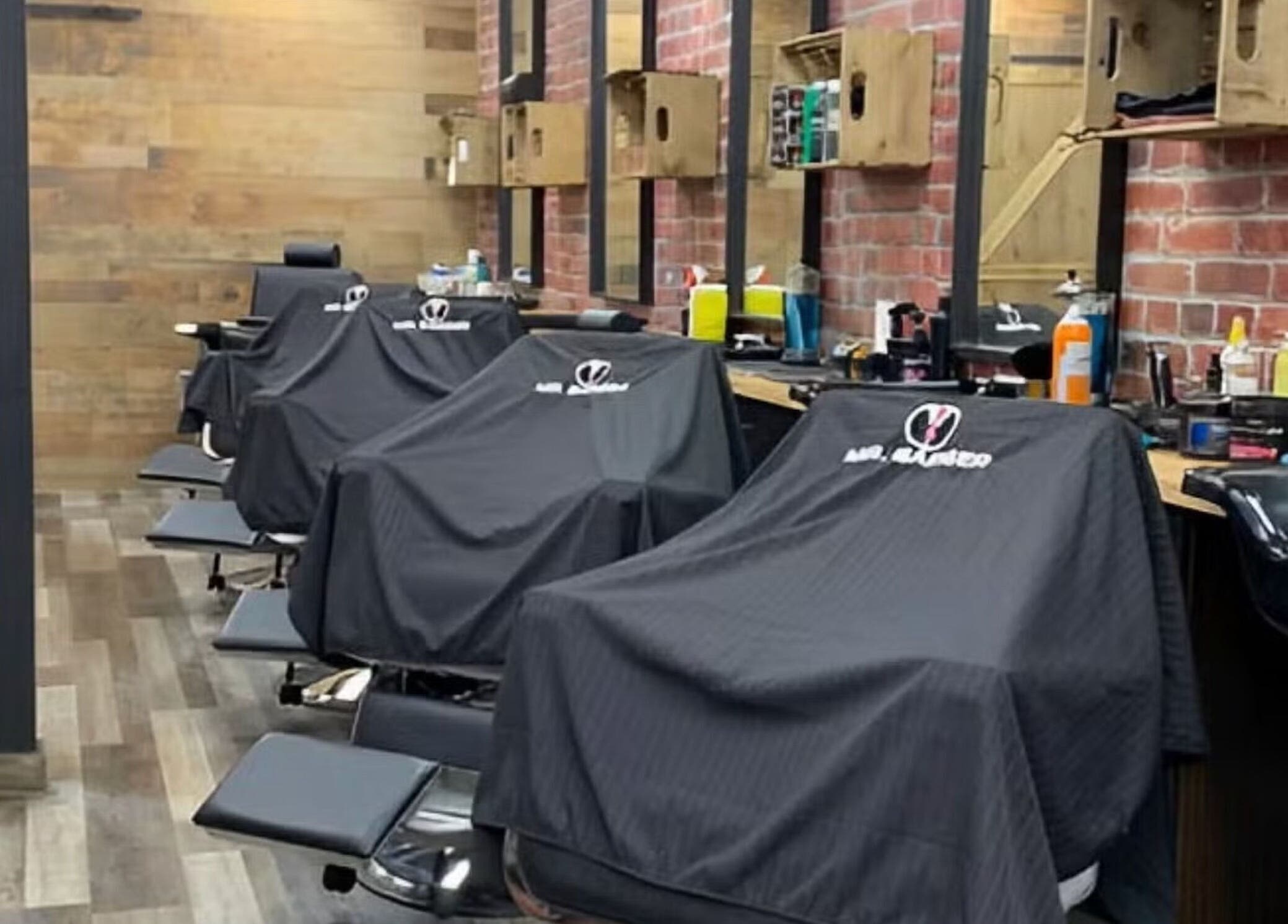 Interior view of Mr. Barber Griesbach in Edmonton, Alberta, CA, showcasing multiple barber chairs.