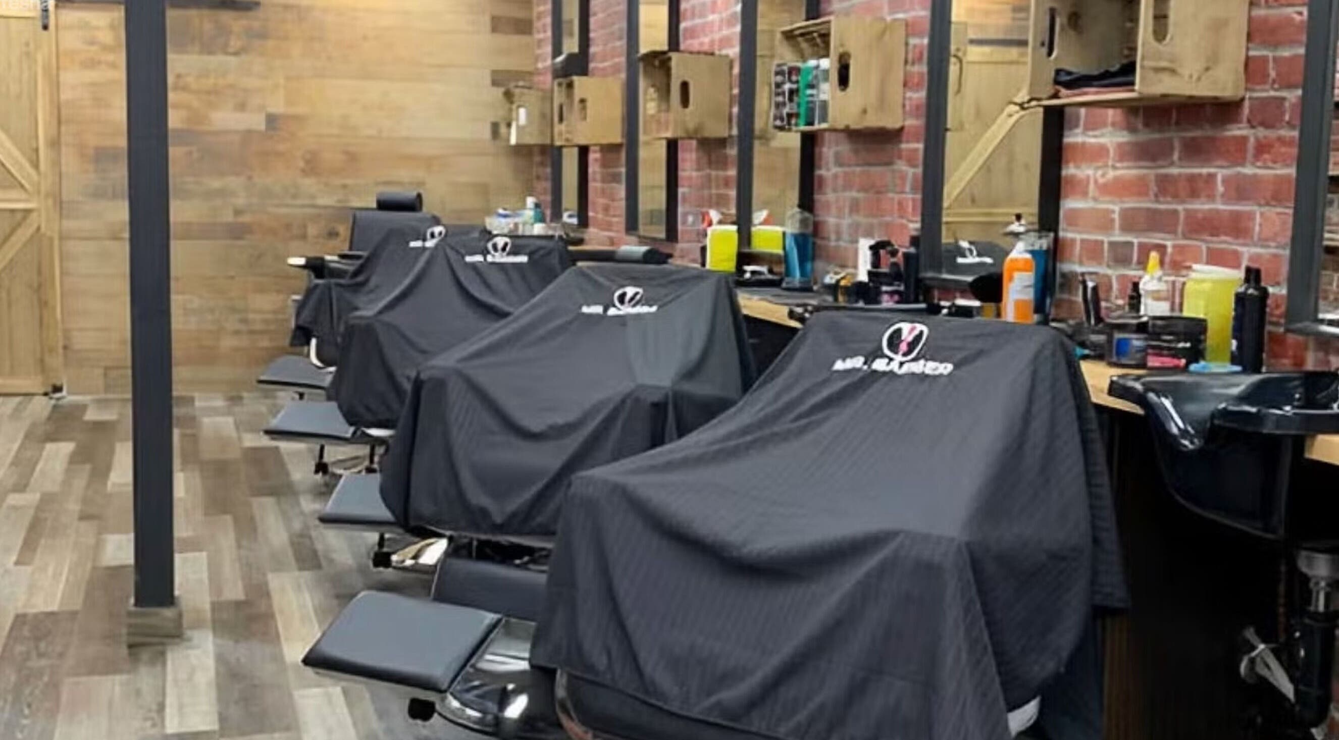Interior view of Mr. Barber Griesbach in Edmonton, Alberta, CA, showcasing multiple barber chairs.
