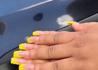 Bright yellow nail art at Three Sisters Spa And Beauty Center, Long bay West end, AI.
