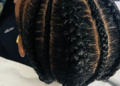 Intricate braided hairstyle at Three Sisters Spa And Beauty Center, Long bay West end, AI.
