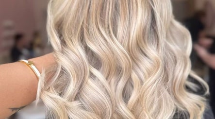Elegant blonde waves styled at Anna Kouro Hair, London, England, GB, showcasing professional hair artistry.