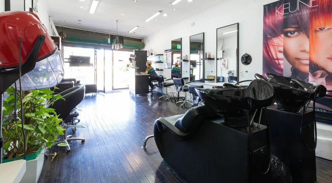 Modern interior of Zara Hair Studio in South Wentworthville, New South Wales, AU with sleek salon chairs.
