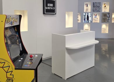 8088 Barbershop - Avant Garde in Dubai, AE with a vintage Pac-Man arcade and modern decor.