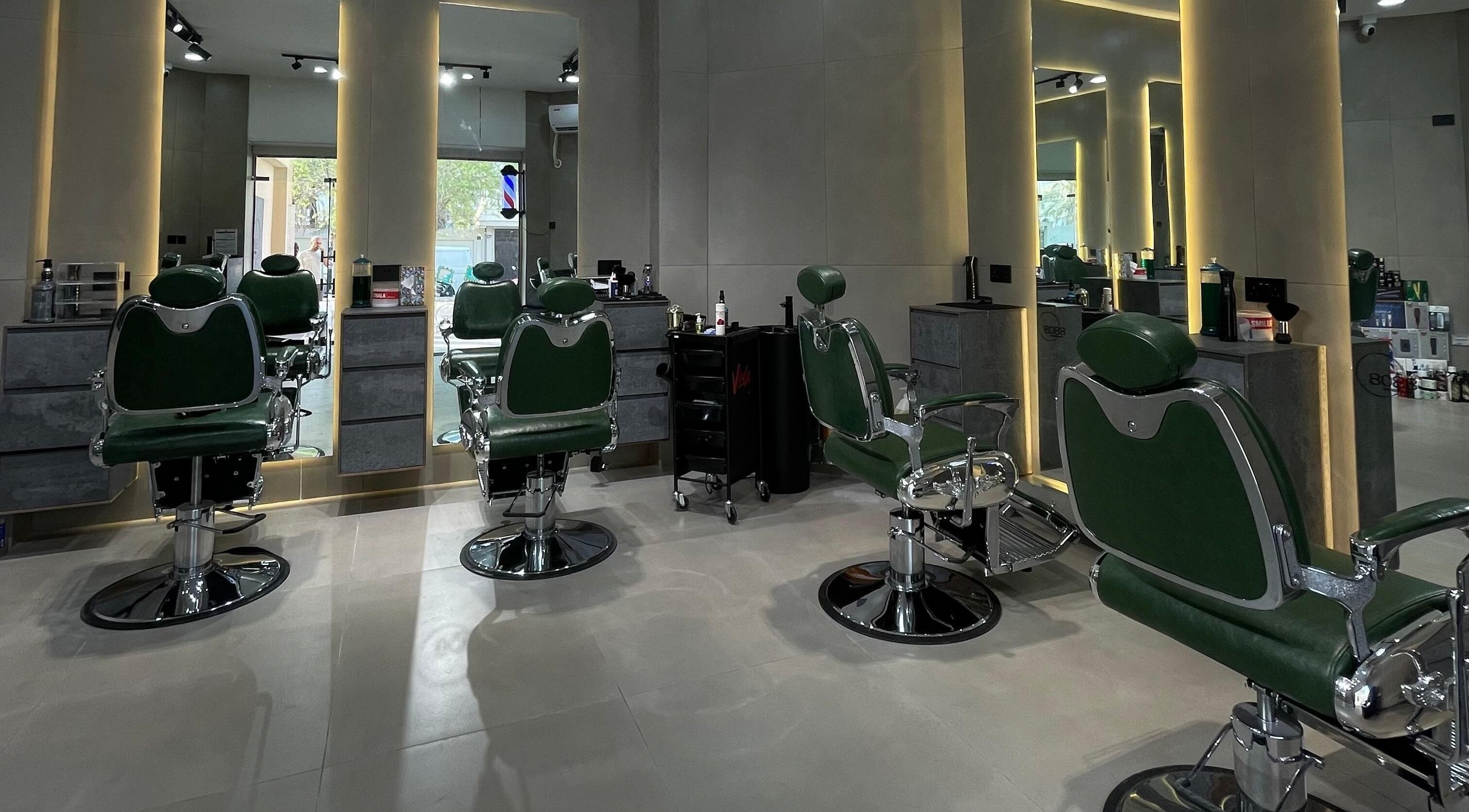 Stylish barber chairs at 8088 Express - Al Jaffiliya, Dubai, AE, highlighting modern salon interior.
