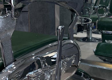 Sleek chrome barber chairs at 8088 Express - Al Jaffiliya, Dubai, AE, offering a premium grooming experience.