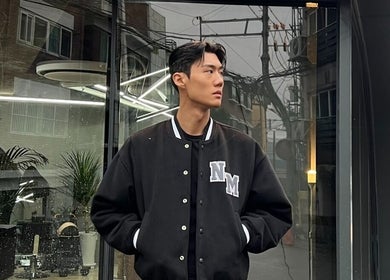 Model in front of Korner Seoul entrance, Seoul, 서울특별시, KR, showcasing modern urban style.